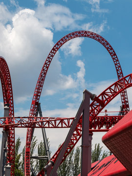 Red Roller-coaster Track inside Public Amusement Park