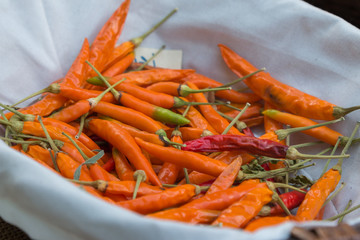 Orange Dried Chili Peppers inside White Bowl