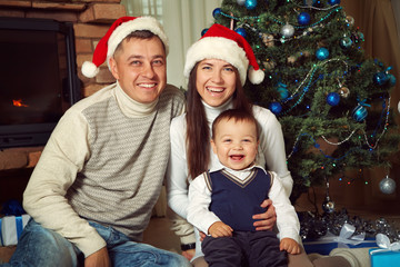 family celebrating Christmas at home