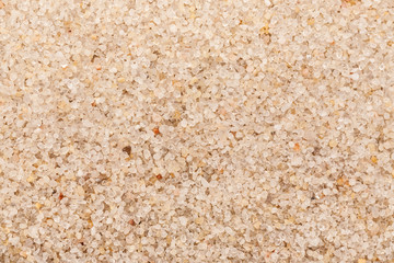 Light beach sand macro shot, abstract texture