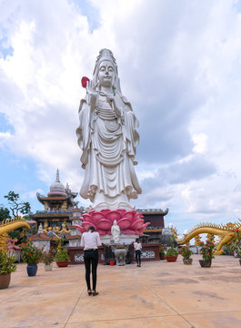 Dong Nai, Vietnam - October 8th, 2017: Buddhists Praying the buddha in the ancient architectural pagoda with beautiful statues depicting religious spiritual culture in Dong Nai, Vietnam.
