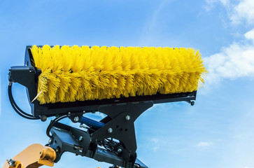 brush for street cleaning ha harvesting technique on the sky background