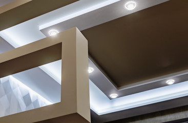 suspended ceiling and drywall construction in the decoration of the apartment or house. focus on...
