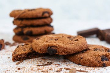 Cookies with chocolate on dark wooden background