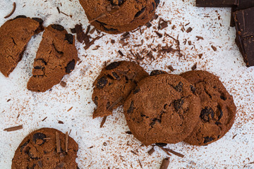 Cookies with chocolate on dark wooden background