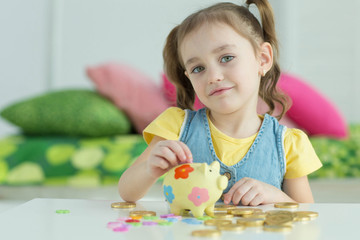 Child with a piggy bank 