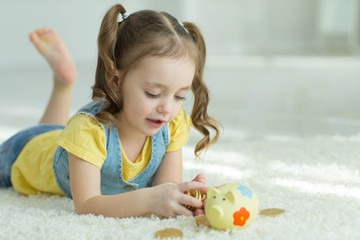 Child with a piggy bank 