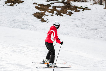 skier is skiing down the slope in the woods