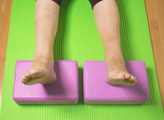 Rehabilitation exercises with yoga blocks for seniors