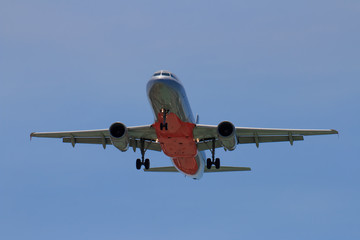 Fototapeta na wymiar Passenger Airplane Taking Off Into The Blue Sky