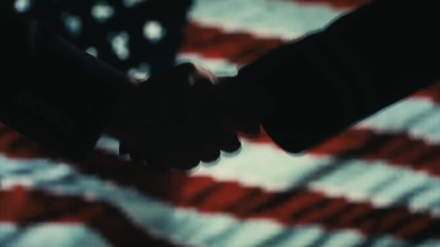 Funy Handshake. Multiple takes. USA flag on LED background.