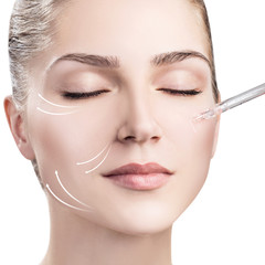 Woman's face with lifting arrows and cosmetics oil