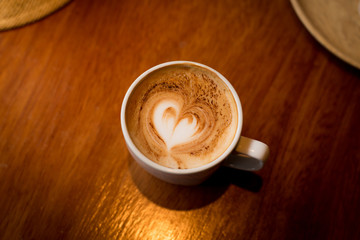 Coffee cup on table.