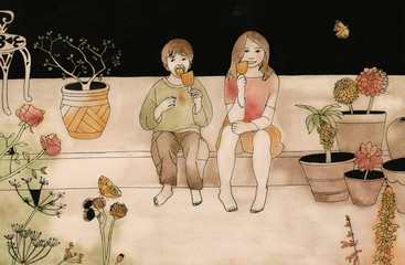 Boy and girl in garden eating popsicle