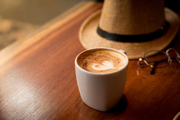 Coffee cup on table.