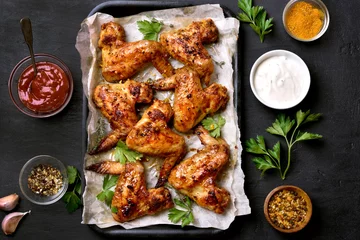 Tuinposter Grilled chicken wings, top view © voltan