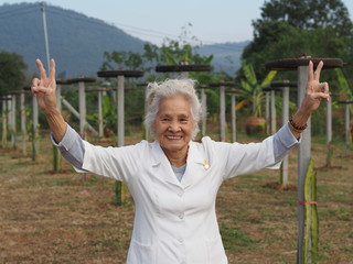 Healthy Asian senior woman enjoying her day outdoors