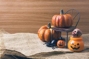 halloween pumpkin with decor and wood background