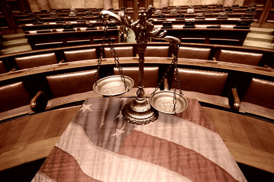 Decorative Scales of Justice in the Courtroom and flag of the United States