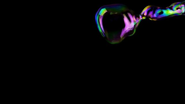 Hand making colorful soap bubbles background. Slow motion.
