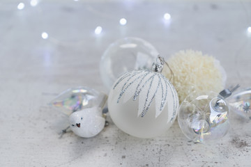Obraz na płótnie Canvas White winter christmas scene with set of glass ball and bird decorations