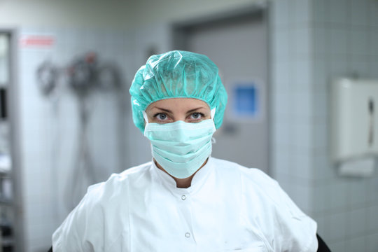 young female doctor with surgical face mask, sterile, surgeon, ambitious