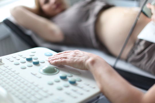 happy single scandinavian pregnant woman at doctors clinic for 3d scan, happy and excited