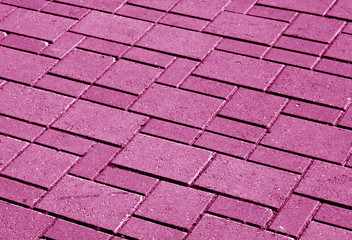 Pink color pavement pattern with blur effect.