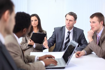 businessman holds working meeting with employees