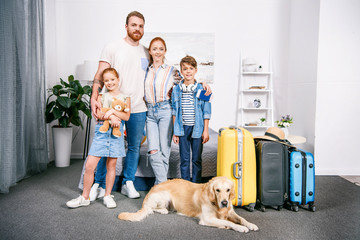 family with dog ready for trip