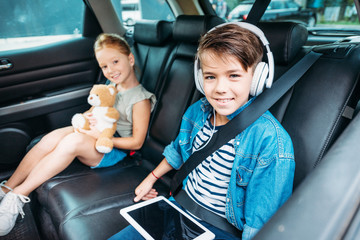 brother and sister ready for car trip