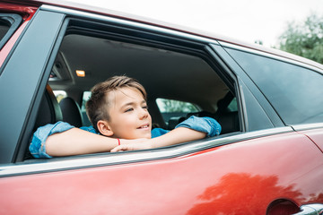 boy looking out of car window