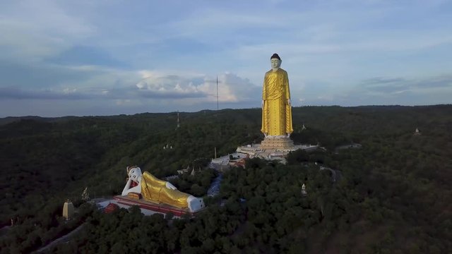 4k aerial of the giant buddha of Maha Bodhi Tahtaung in top of the fill of Monywa mountain, 4k Aerial footage Myanmar (Burma)