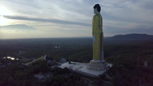4k aerial of the giant buddha of Maha Bodhi Tahtaung in top of the fill of Monywa mountain, 4k Aerial footage Myanmar (Burma)