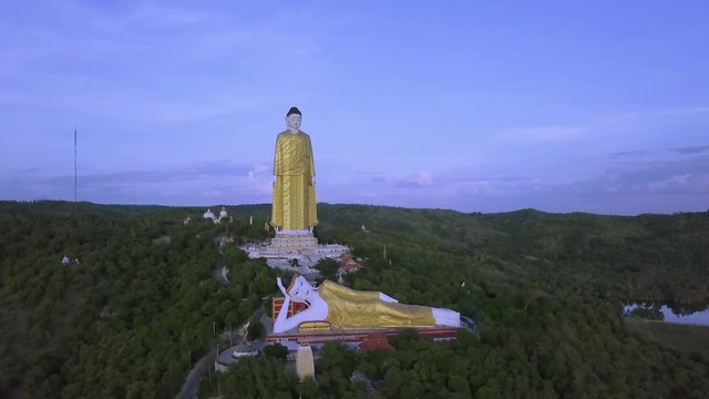 4k Aerial front view of giant buddhas: reclining Buddha of 90 meter long meter and high standing Buddha of 116 meter, Monywa Hill, Myanmar (Burma)ng meter and high standing Buddha of 116 meter, Monywa