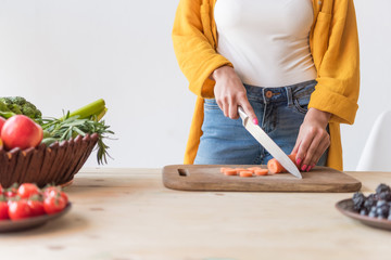 woman cutting carrot