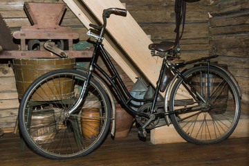 old black rusty bicycle in old country house