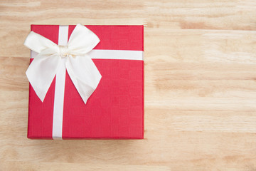 Gift box on wood table Christmas day and happy new year