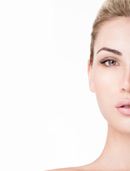 Beautiful face of young adult woman with clean fresh skin. Long eyelashes.