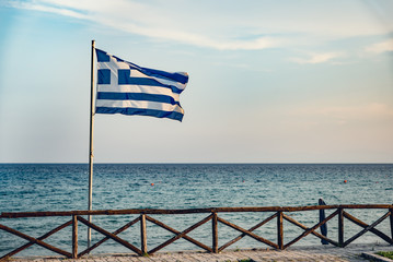 Greek flag by the sea