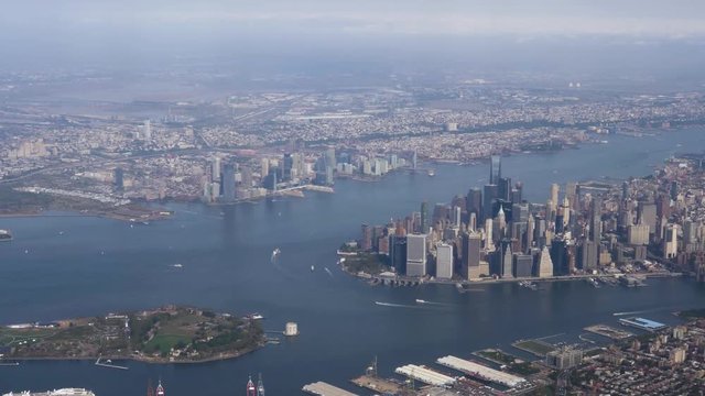 A daytime aerial establishing shot of the island of Manhattan. Part 1 of 2.  	