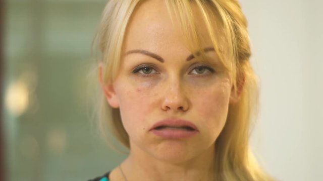 Facial massage, girl exhales through the mouth. Slow moiton