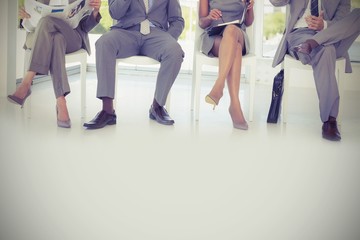 Business people sitting on chairs