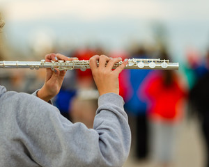 hands of a flute player at rehearsal