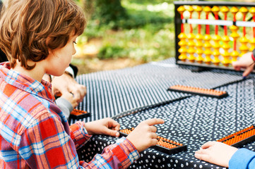 The boy thinks on the abahus in the open air