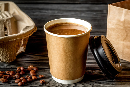 Coffee Cup To Go At Wooden Background