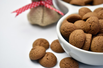 Mini Dutch spice cookies or pepernoten displayed in a bowl ready for the traditional sinterklaas celebrations that happen in the Netherlands during December