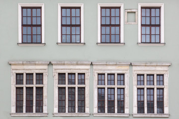 Eight Windows on the facade of the old vintage houses