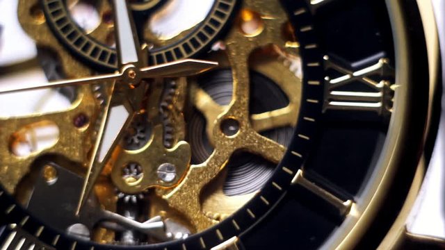 Gold watch arrow, clock closeup