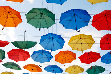 Fototapeta na wymiar multicolor umbrellas in the sky